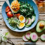 Healthy food, bowl with avocado, tomatoes, eggs and spinach