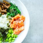 Healthy salad bowl with salmon, soybeans and seaweed