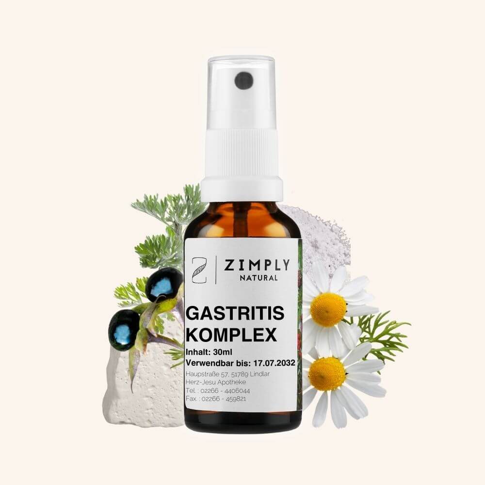 Gastritis complex as brown flakes with spray head from Zimply Natural with medicinal plants in the background such as wormwood, belladonna, kaolin, chamomile, sodium phosphate, with beige background