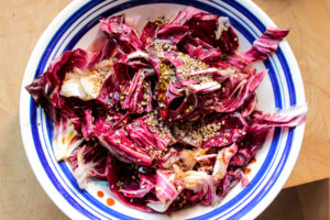 A bowl of freshly marinated radicchio salad with sesame seeds